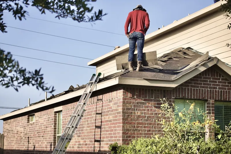Professional roofer working on a residential roof in Buckingham Park